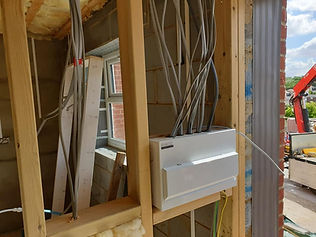 First fix electrical consumer unit installation with grey wiring inside wooden stud partitioning work