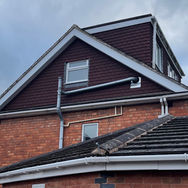 Dormer loft extension exterior with matching roof tiles