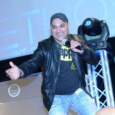 A group of six people sits at a table with microphones, appearing to address a press conference