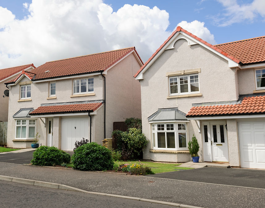 White rendered semi detached houses with brown tiled roof in Doncaster
