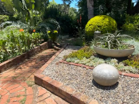 A close-up of rockeries decorated on the sides of the pathways