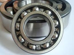 Close-up of a ball bearing with multiple steel balls inside a circular metal casing