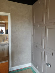 Geometrical wainscoting on a light grey wall