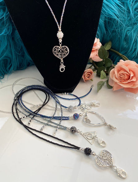 Black beaded jewellery piece with heart shaped clear pendant