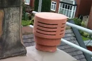 Close-up of a chimney pot on a rooftop