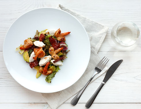 Traditional Italian seafood salad with shrimp and mozzarella