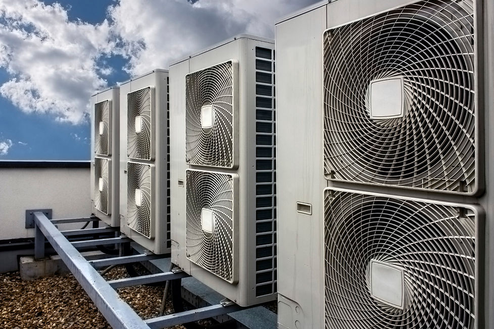 Commercial air conditioning condensers installed outside on a building roof