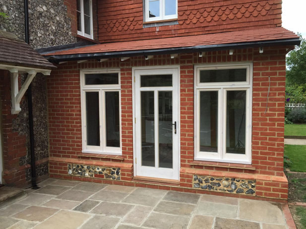 Matching white wood windows and patio doors
