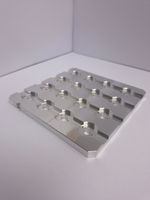 Aluminum sheet with circular indentations on white