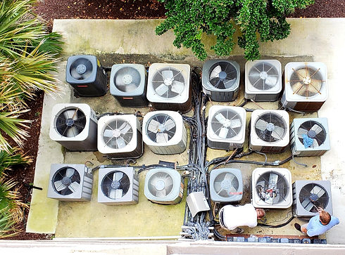 Top-down view of multiple outdoor air conditioning condenser units installed together