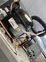 Close-up view of a refrigerator compressor