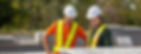 Team leaders auditing safety systems at the work site in an industrial yard.