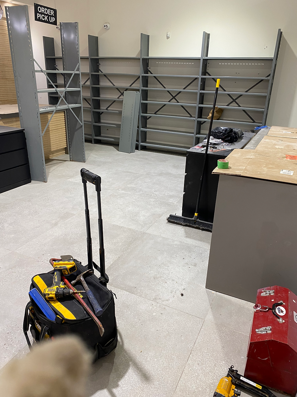 Commercial renovation site showing tools and materials staged during interior construction.