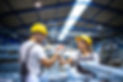 factory-workers-handshaking-each-other-production-line.jpg