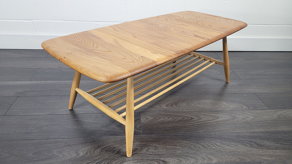 Ercol Model 459 Coffee Table showing solid elm top and spindle magazine rack
