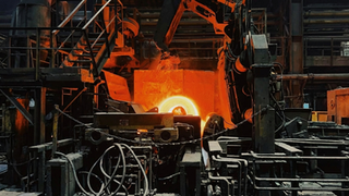 Glowing hot metal in an industrial furnace