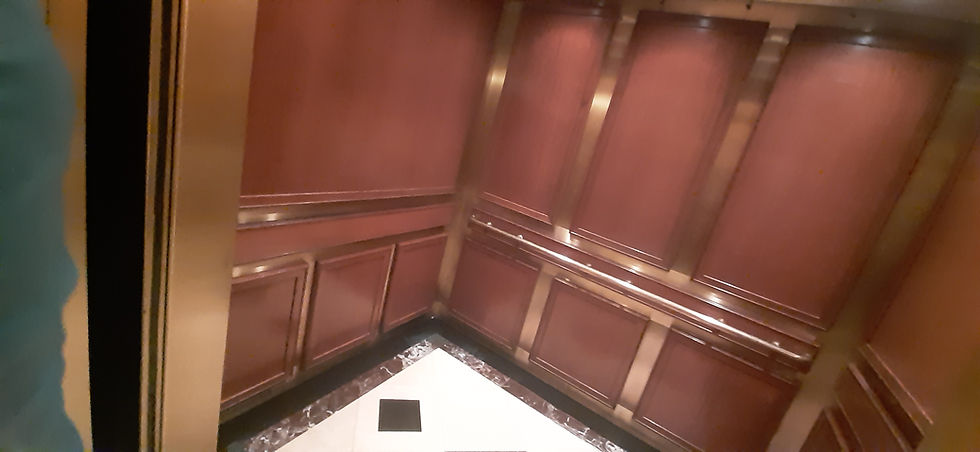 Clean wood-paneled elevator for professional move out cleaning services