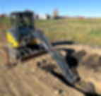 John Deere 35G excavator trenching for utility line installation in Leduc.