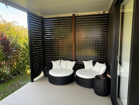 Aluminium weatherproof slats to create a private and stylish patio area.