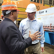 Marketing photo delegate and man in hard hats.jpg