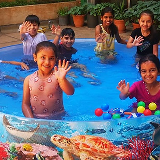 refugee children in summer pool