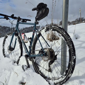 Jon's gravel bike parked in the snow at the top of that Damn Hill