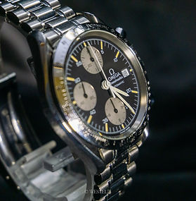 The Omega 3511.50 is a Speedmaster Reduced with a 39mm stainless steel case, black dial, and automatic chronograph movement. It comes on a stainless steel bracelet with a folding clasp, offering the classic Speedmaster look in a smaller, more wearable size that is highly regarded by collectors.
