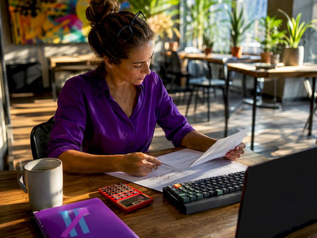 Trader reviewing mechanical trading rules at home office