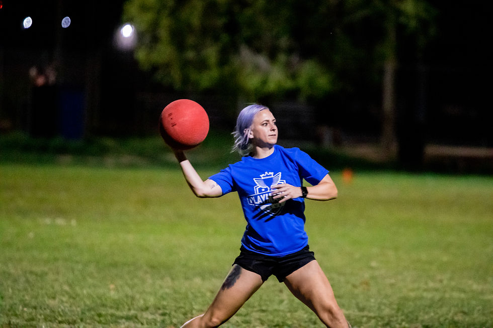 Kickball players enjoying league night with PlayMakers Club