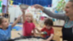 Children doing a flour activity in Belsize Village Nursery