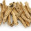 Thumbnail: Close-up of dried, tan herbal roots on a white background.