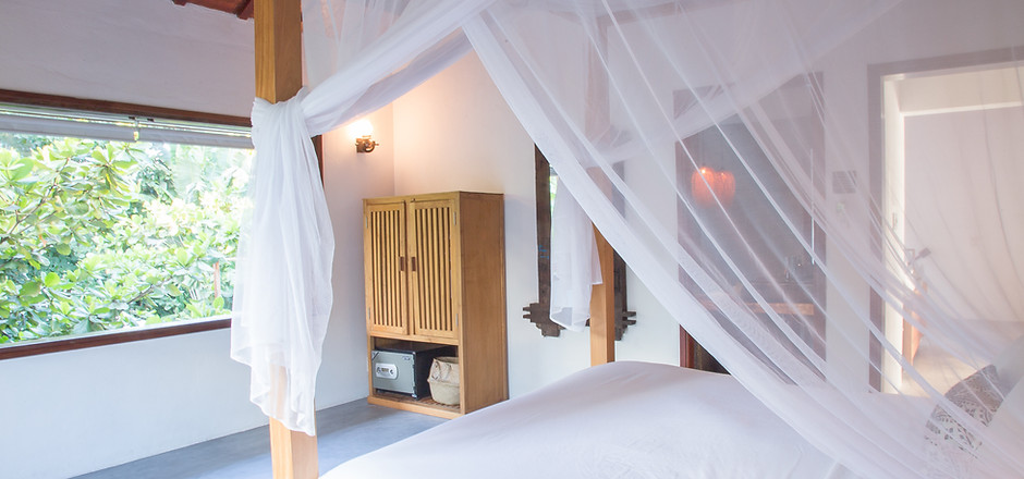 Hoi An beach Villa two story large windows tropical breezes mosquito nets cocktails by the
