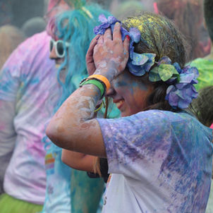 Runners getting sprayed with paint colors