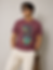 Man in maroon Regular Slim Fit Tee with graphic, sunglasses.