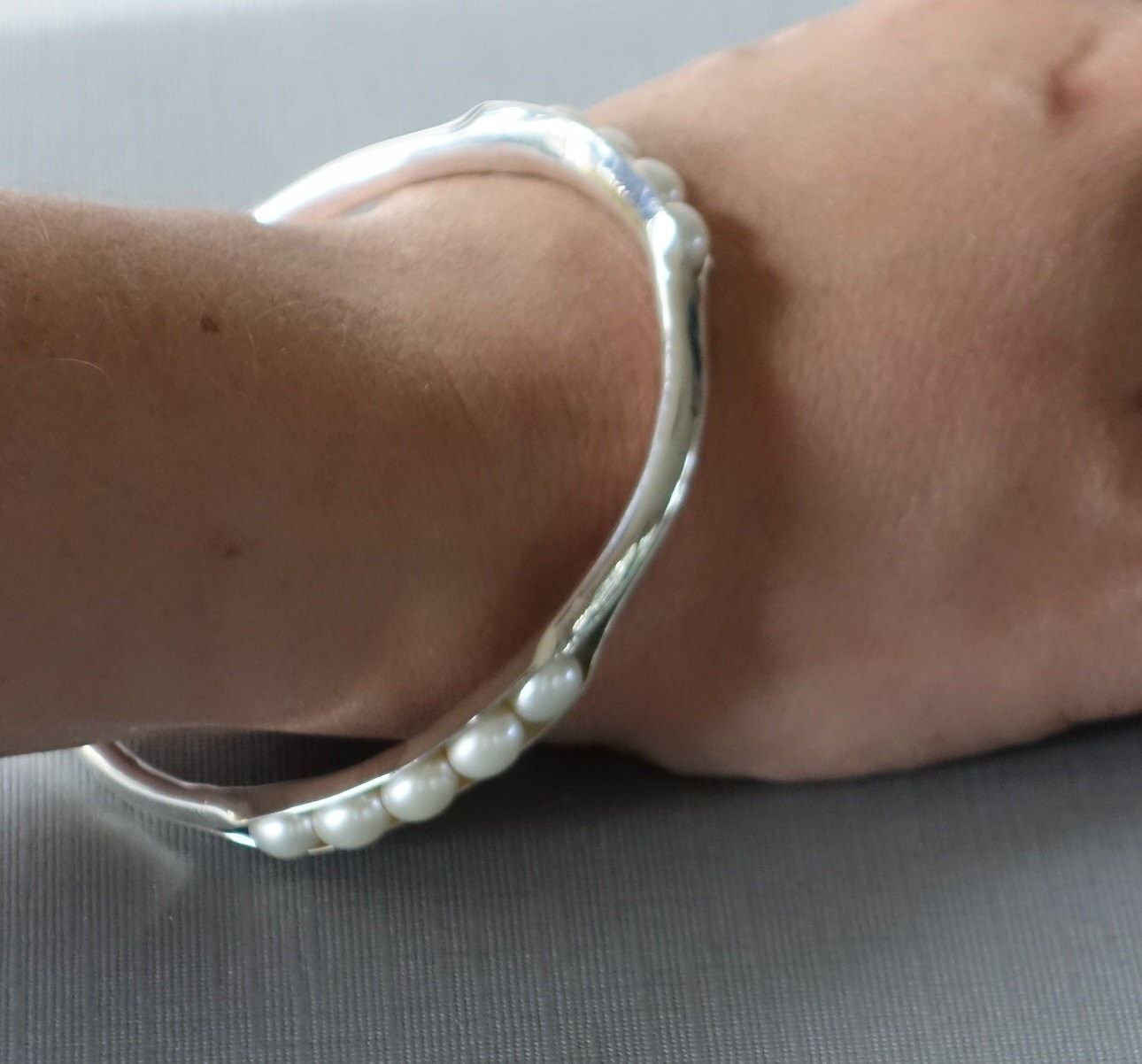 Pearl Bracelet, Anticlastic Pearl Bangle, White Pearl Bangle, Metalwork Bangle