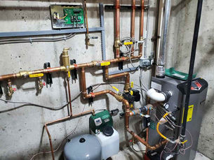 Boiler and hydronic distribution in an Arvada, Colorado mechanical room
