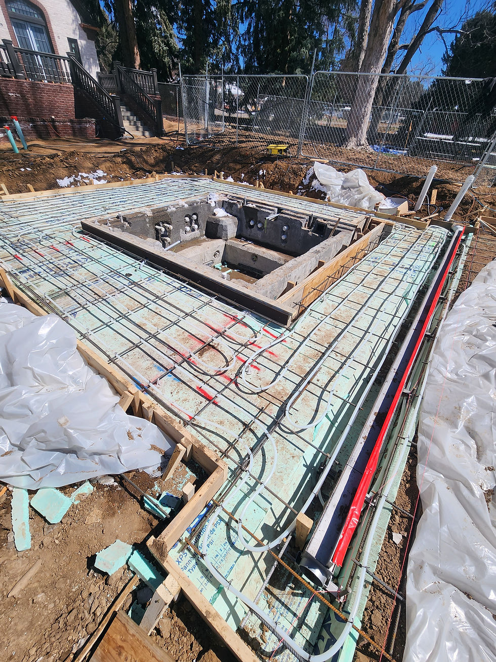 Snowmelt tubing and rebar around a manifold vault during construction