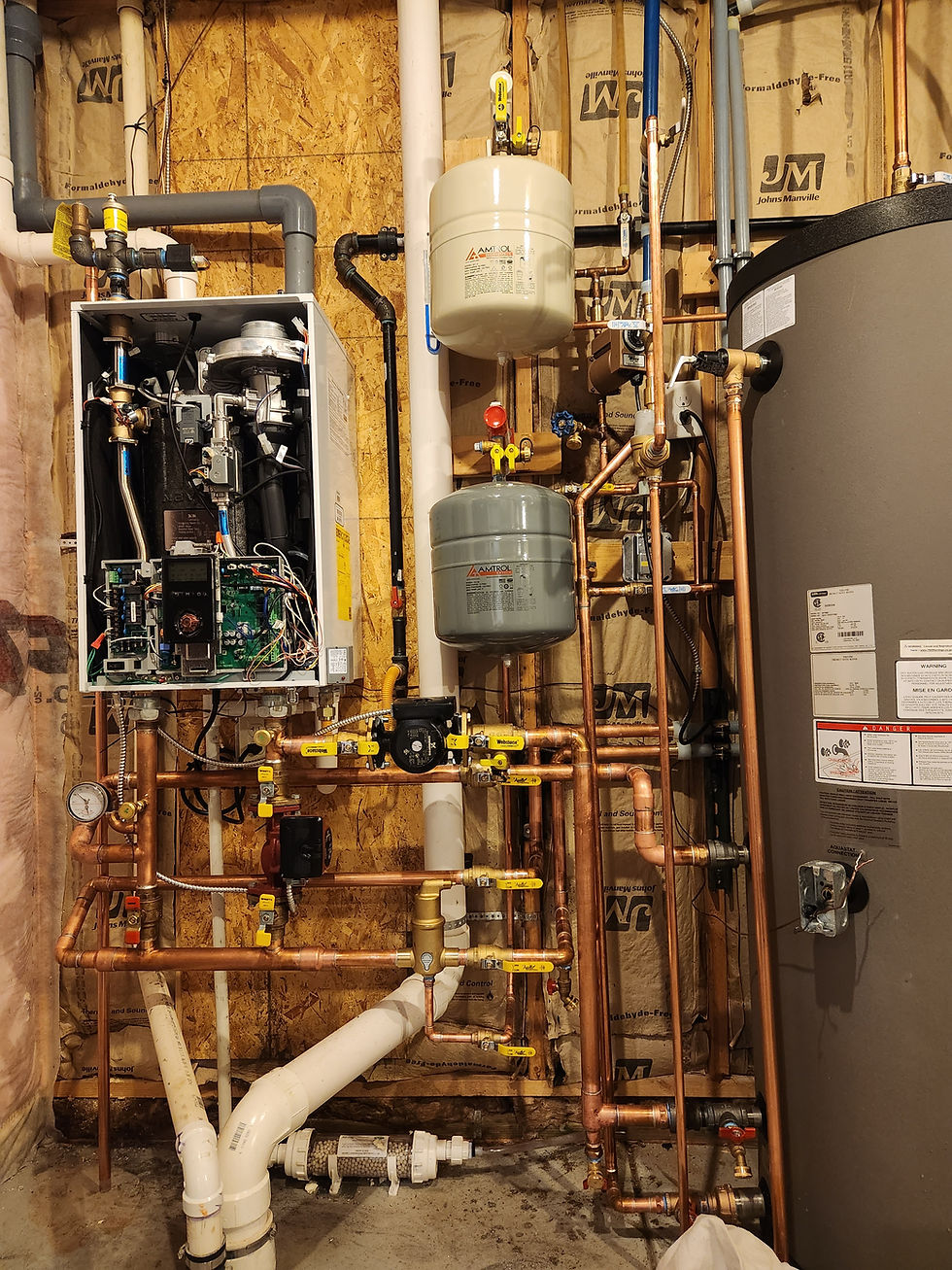 Wall-hung condensing boiler and copper near-boiler piping in a Denver home