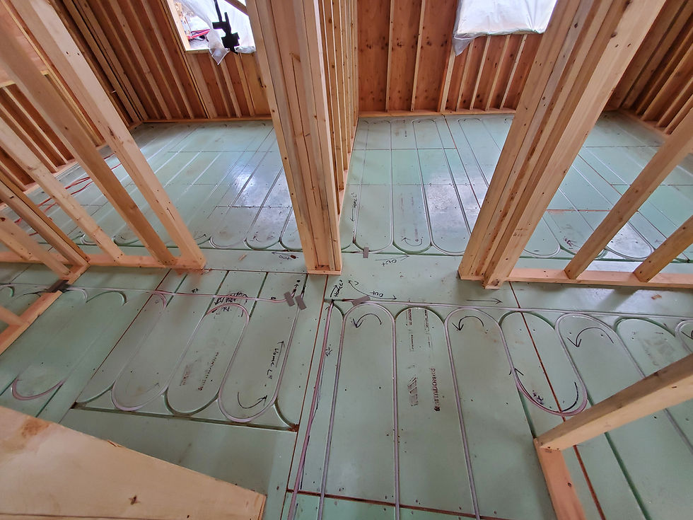 PEX tubing in Warmboard low-mass radiant panels across a framed residential floor