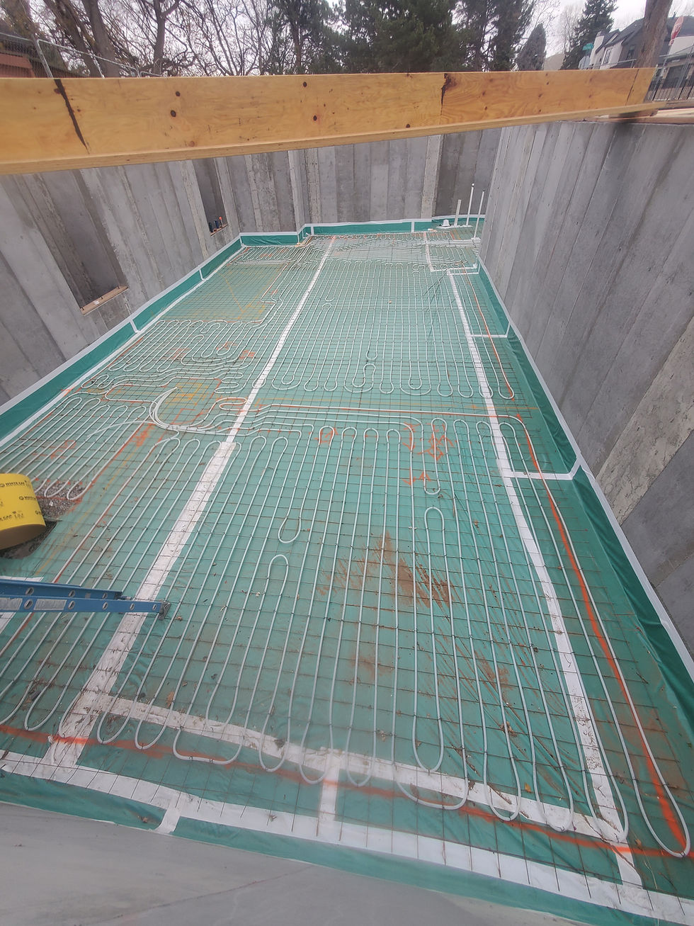 High-mass radiant tubing loops laid over slab insulation