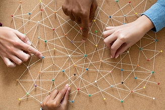 hands-connecting-colorful-pushpins-with-string-on-2026-10-08-16-12-38-utc.jpg