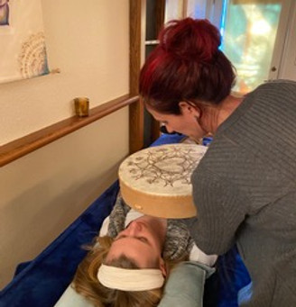 team member doing intuitive shamanic breathwork on a client