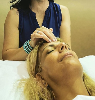 team member doing bars on a client