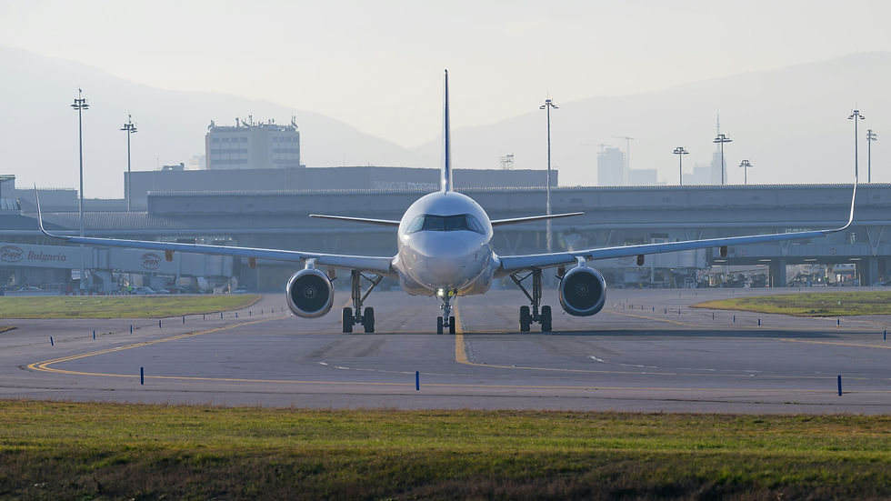 Commercial passenger airplane taxiing on an airport runway as U.S. airfare prices rise in 2026