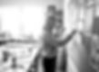 Firefly_Playful lifestyle portrait of a graphic designer pinning work to a wall, slight sm