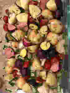 Heirloom potatoes, onions, cherry tomatoes and herbs - ready for roasting!