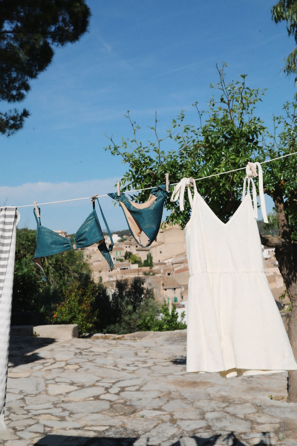 Model wearing swimwear during a shoot in Mallorca for a campaign production for romanian swimwear brand.