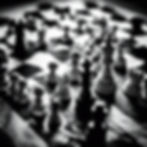 Hands playing chess with a background black.jpg