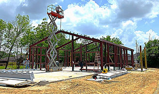 Exterior_View Front Left_with Man on Lift.jpg