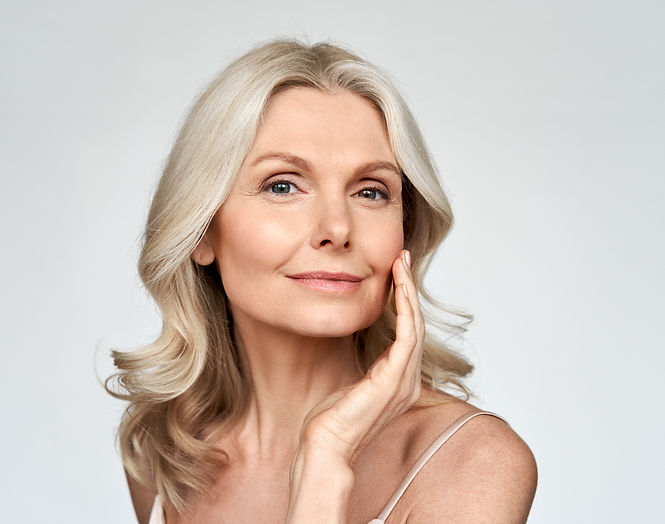 Woman with radiant, glowing skin after professional chemical peel treatment in a New York City clinic.
